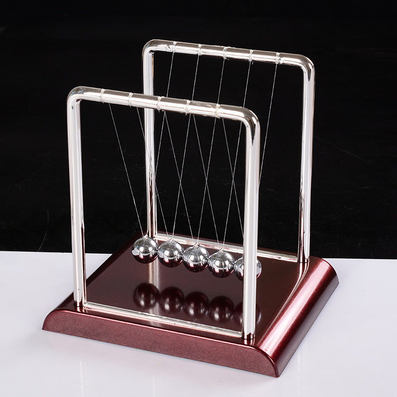 Newton pendulum perpetual mover collision ornament