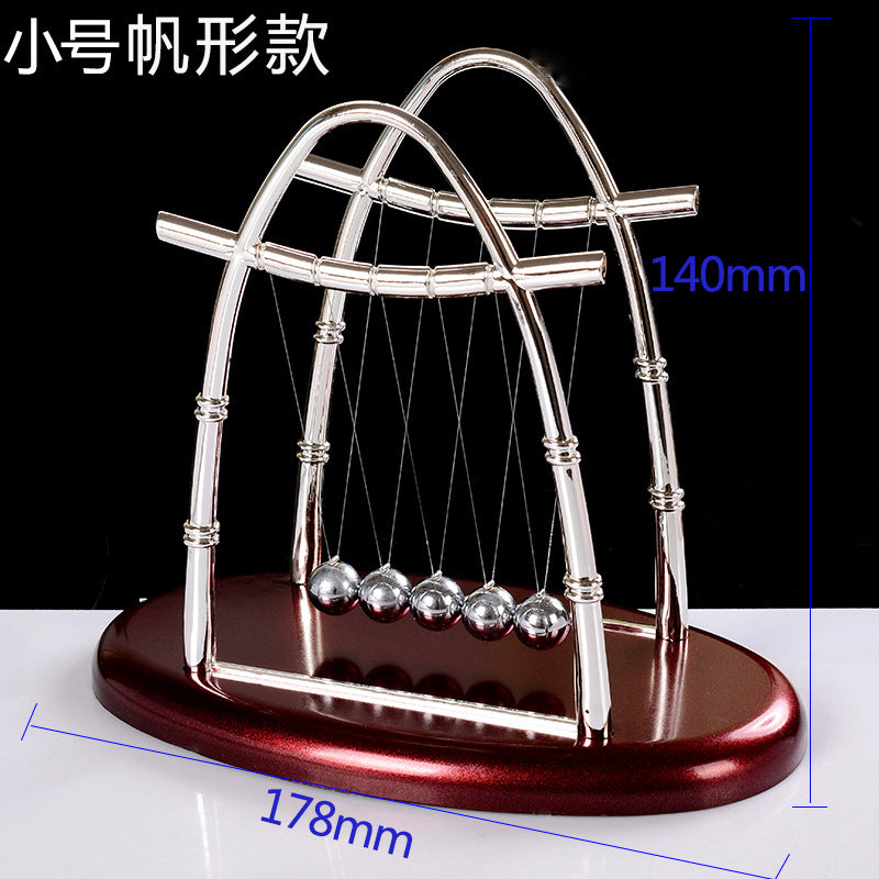 Newton pendulum perpetual mover collision ornament