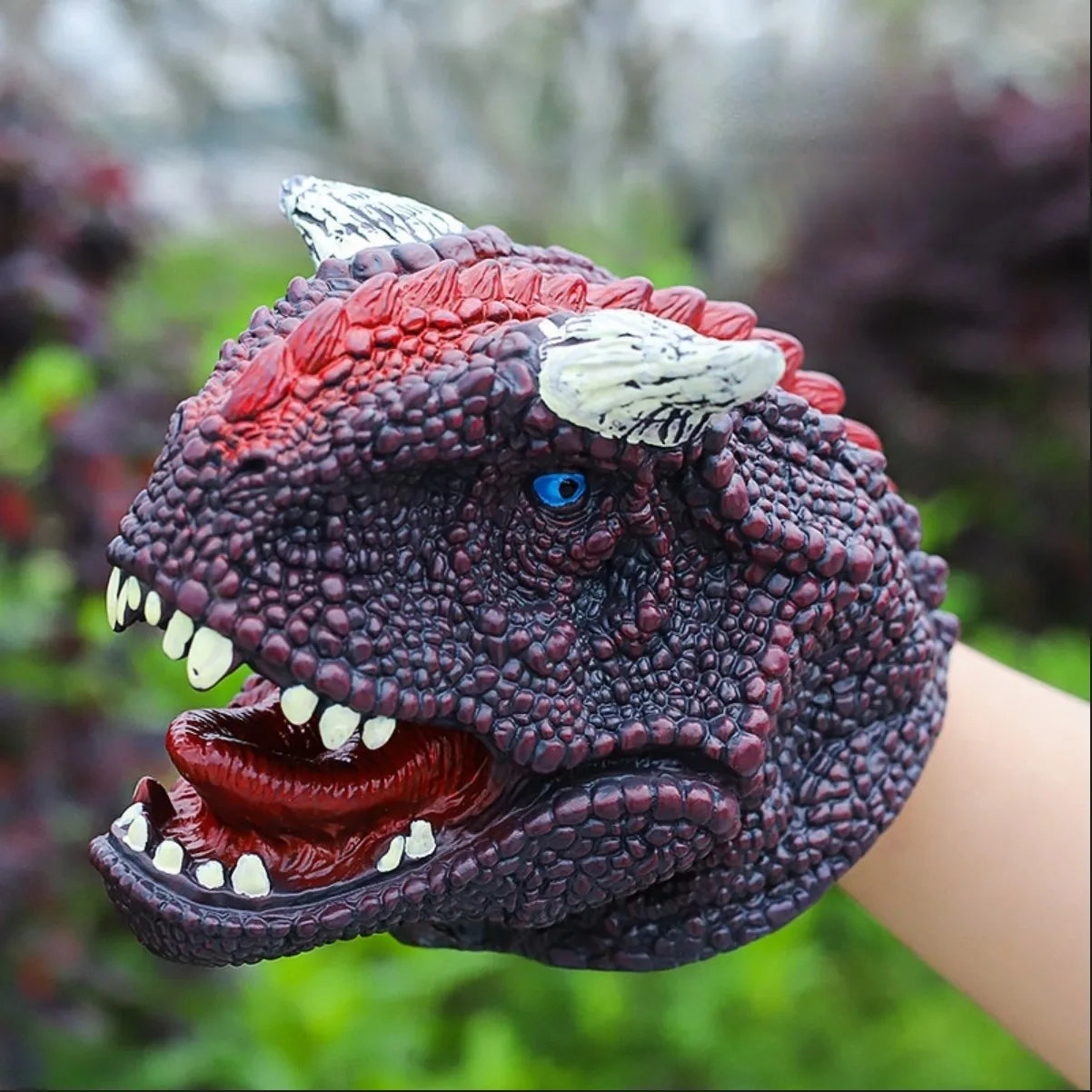 Soft rubber tyrannosaurus rex simulates animal bite