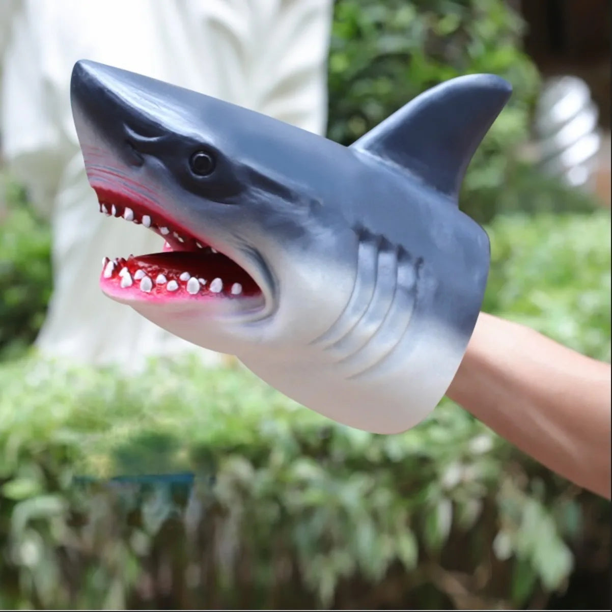 Soft rubber tyrannosaurus rex simulates animal bite