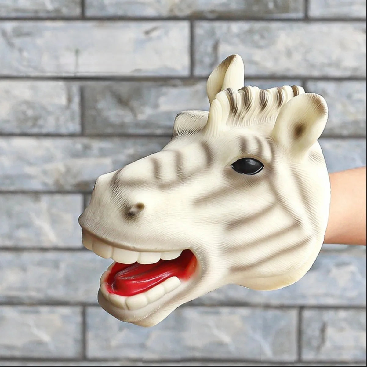 Soft rubber tyrannosaurus rex simulates animal bite