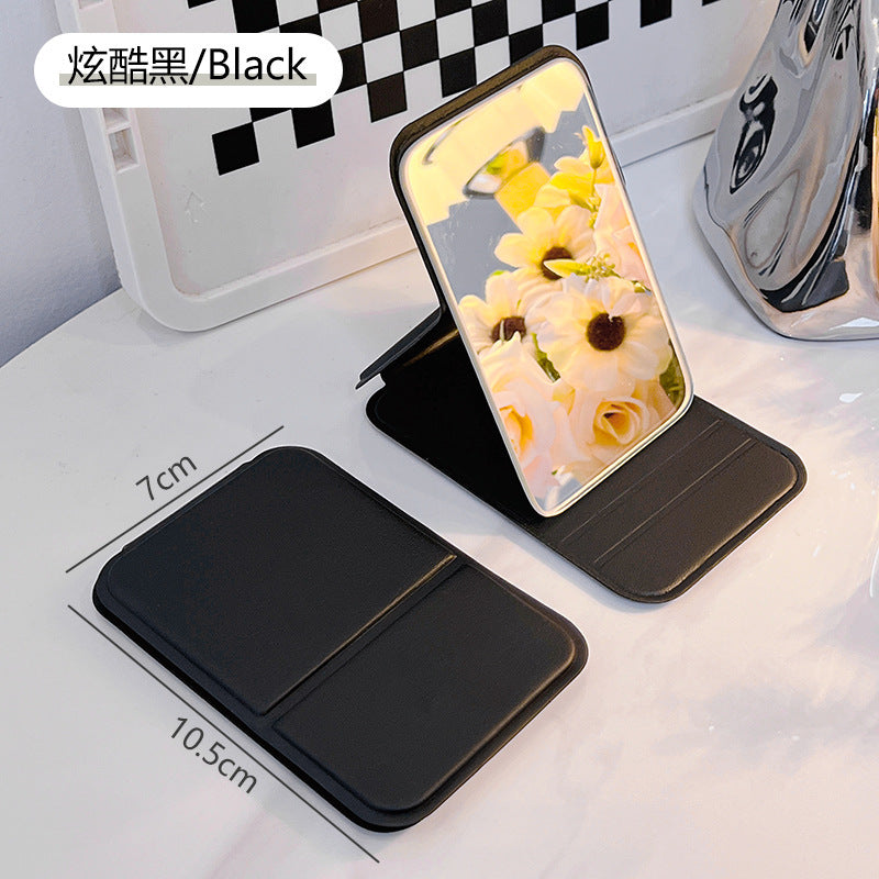 Folding vanity mirror