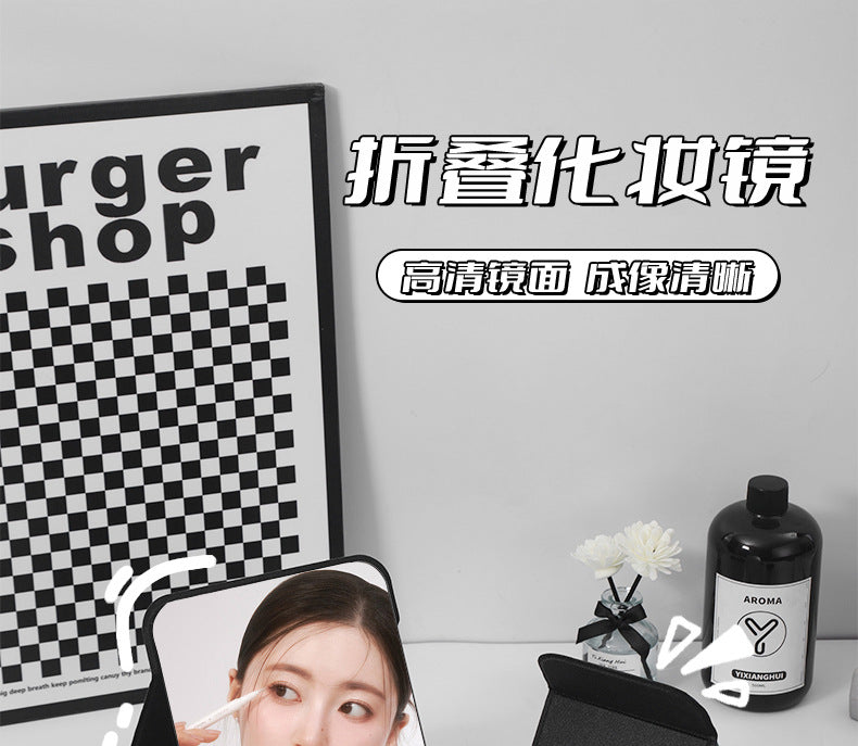 Folding vanity mirror